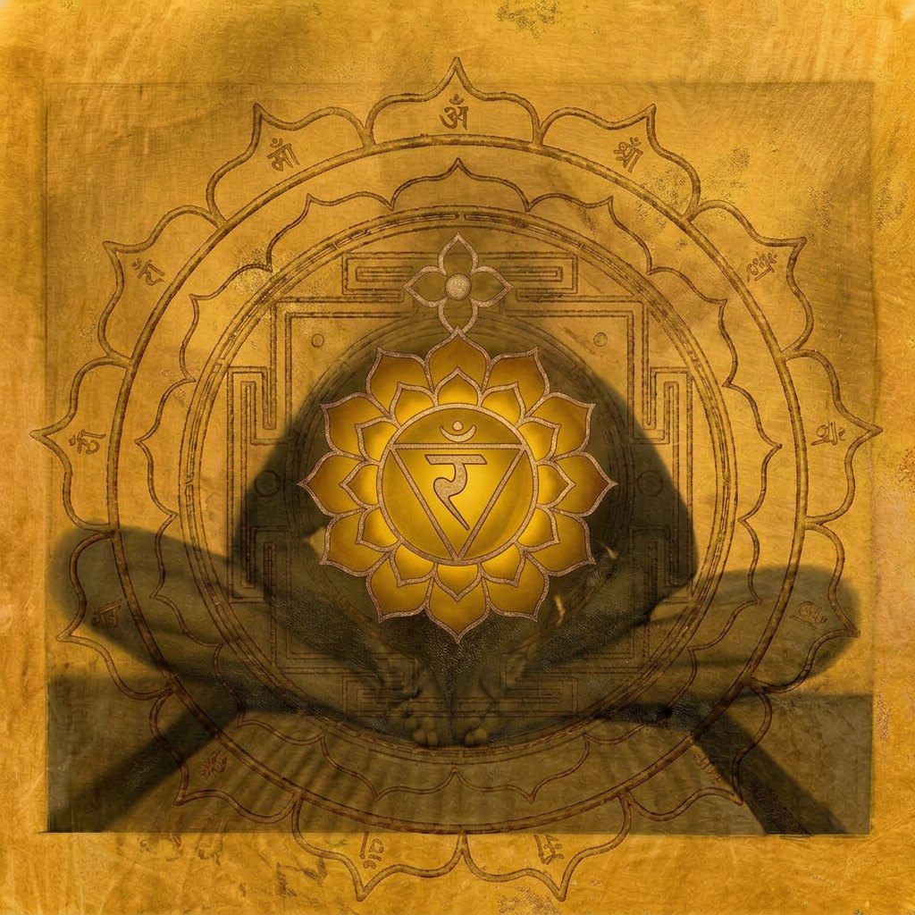Solar Plexus chakra artwork: the Manipura symbol over a seated figure
