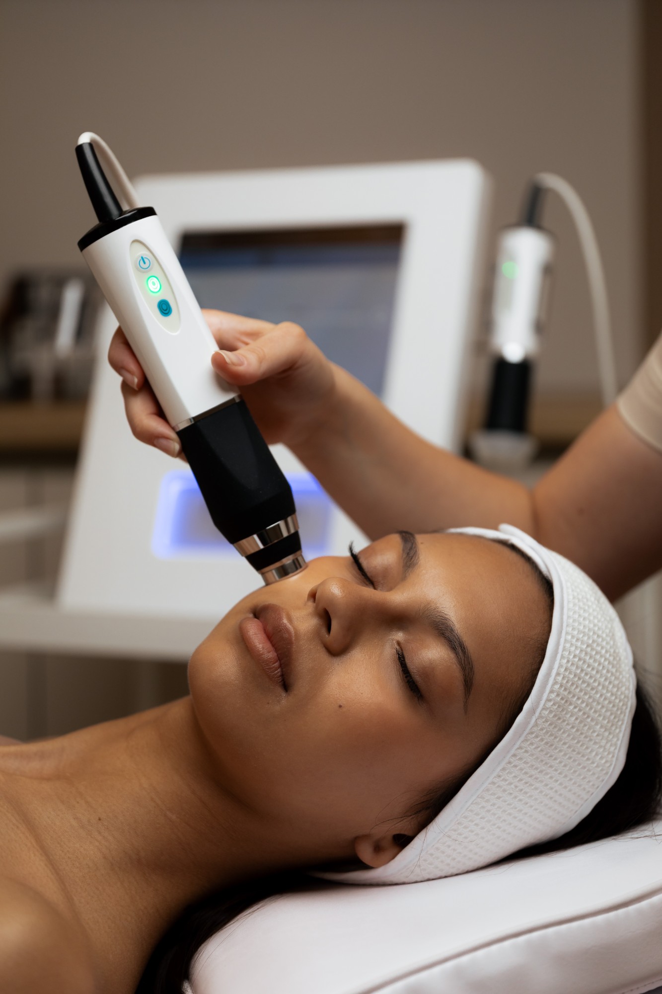 Microcurrent device used along the cheekbone during a facial